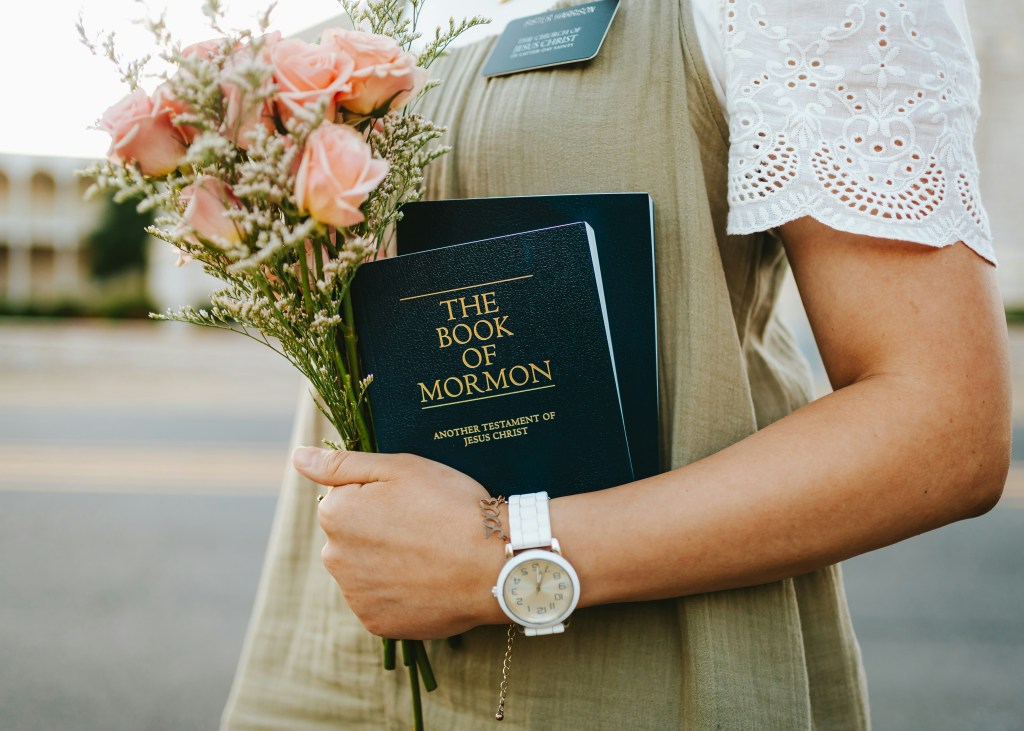 Mormon and flowers, symbolizing faith, values, and the weight of public image and beliefs in the spotlight.